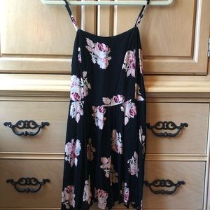 A black romper with pink flowers